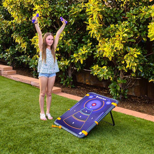 Girl playing with a target game on grass